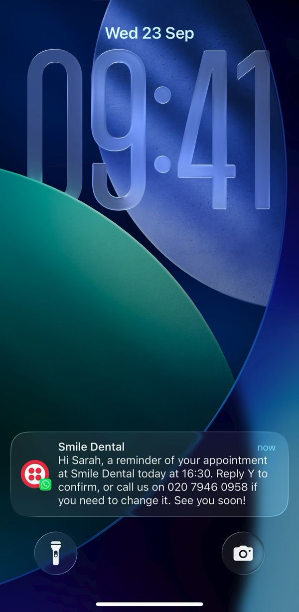Sarah's lock screen at 09:41 on Wed 23 Sep showing the WhatsApp reminder from Smile Dental.